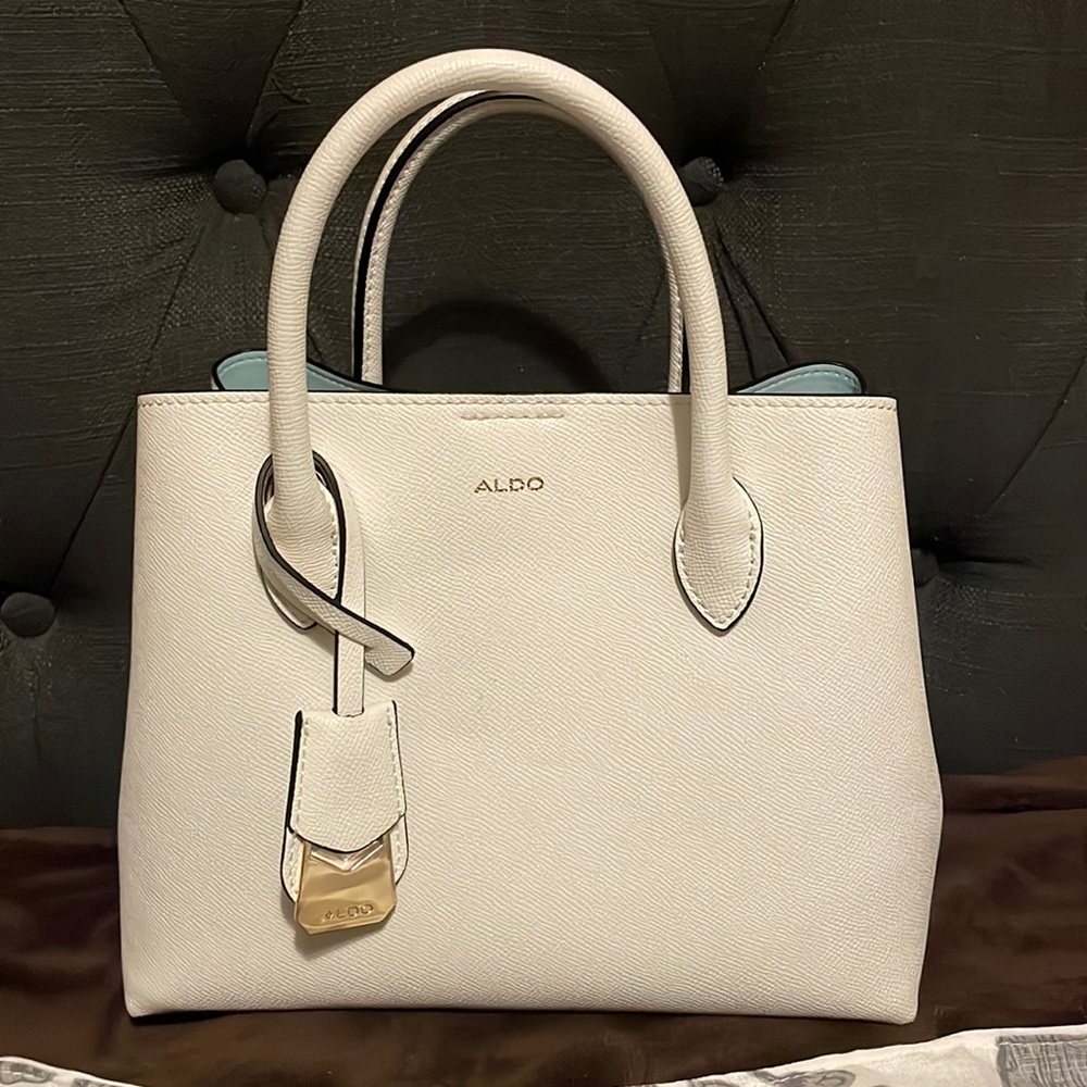Still in great condition, hardly used has 3 bags and comes with a side strap
